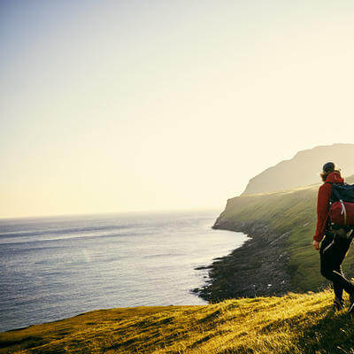 Shot of a young couple hiking through the mountains