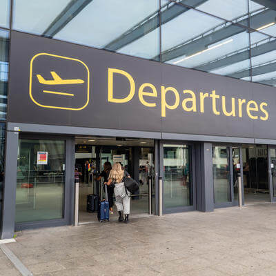 The sign for the departure hall of Gatwick Airport north terminal building