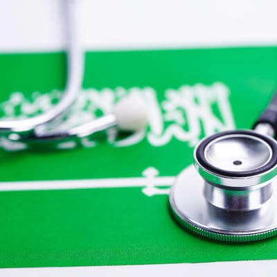 Black stethoscope on Saudi Arabia flag background