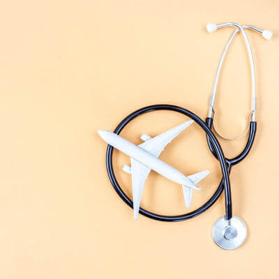 Medical tourism concept airplane and stethoscope