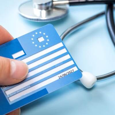 European health insurance card next to a medical stethoscope