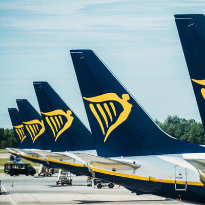 A row of Airplanes belonging to Ryanair Parked at the tarmac