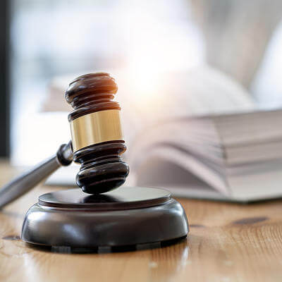 Wooden brown judge gavel on the table