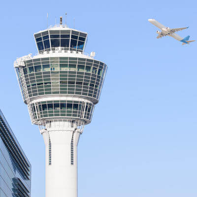 Munich international airport control tower and departing taking off