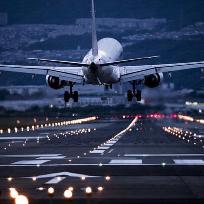 Close-up picture of the back of the airplane arriving at the airport