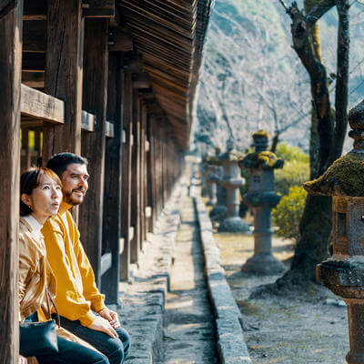Married couple of mixed ethnicity visiting a Japanese shrine