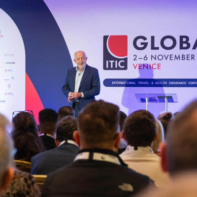 Jeremy Bowen speaking before an audience