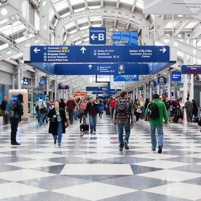 Passengers walking through Chicago O'Hare International Airport 