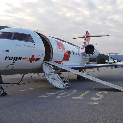 Air ambulance on a runway with an ambulance