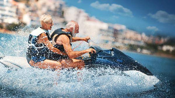 Senior couple on jet ski