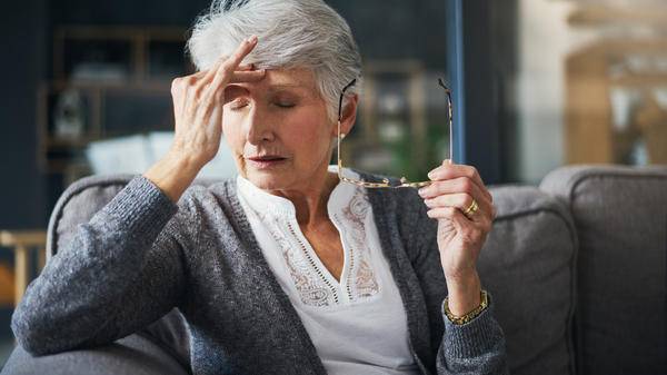 Elderly woman looking stressed