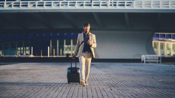 Traveller using mobile phone