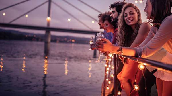 Holidaymakers drinking alcohol on a boat