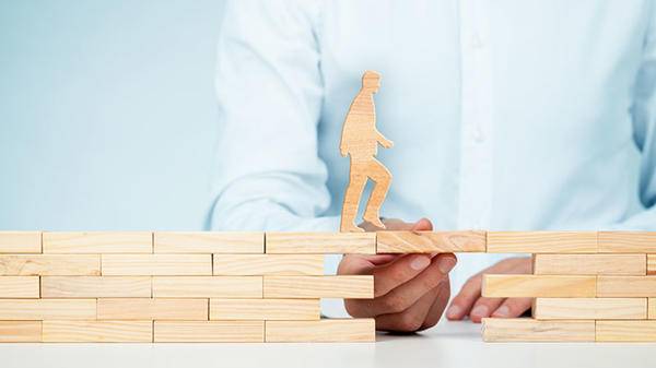 Building a bridge for a wooden figure walking