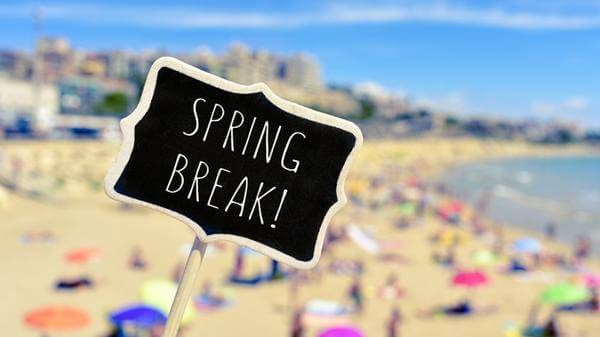 Spring break sign on a beach