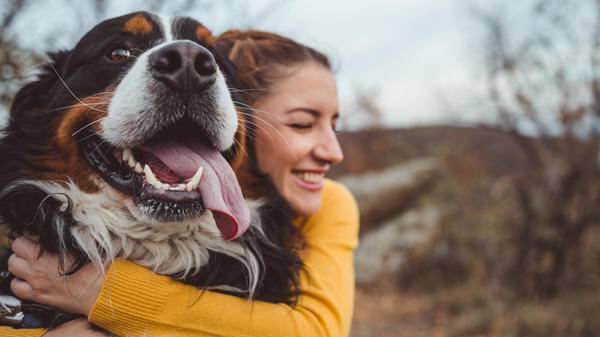 Young lady with her beloved canine companion