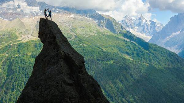 Two female travellers on a cliff