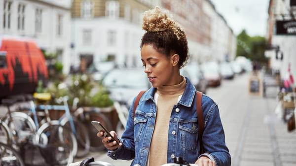 Woman on bike with app