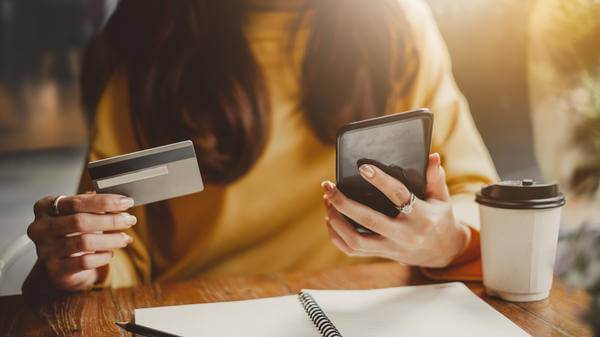 woman phone finances