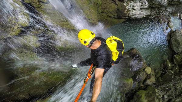 A man canyoning
