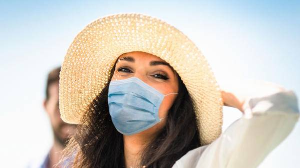 Woman on vacation with mask