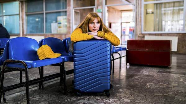 young traveller waiting