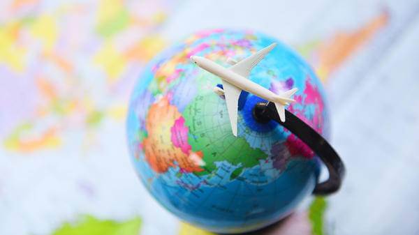 Plane going around globe