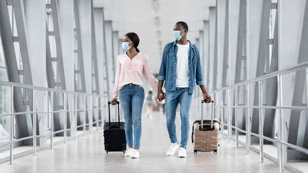 Couple at airport with masks