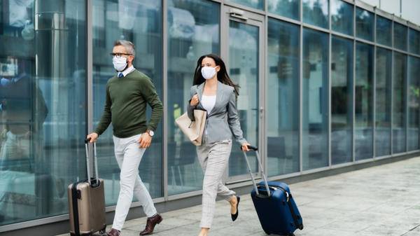 Man and woman travelling for business