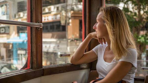 Woman looking out of train window