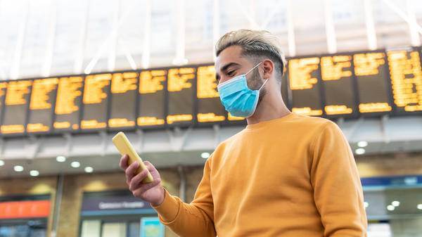 Person at airport with phone