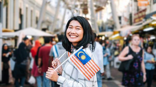 Woman with Malaysian flags