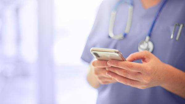 Nurse holding phone