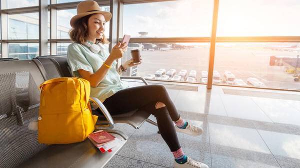 woman airport phone