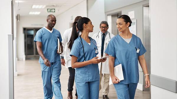 Doctors walking down hospital corridor