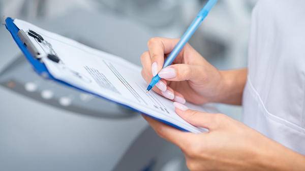 Doctor filling form