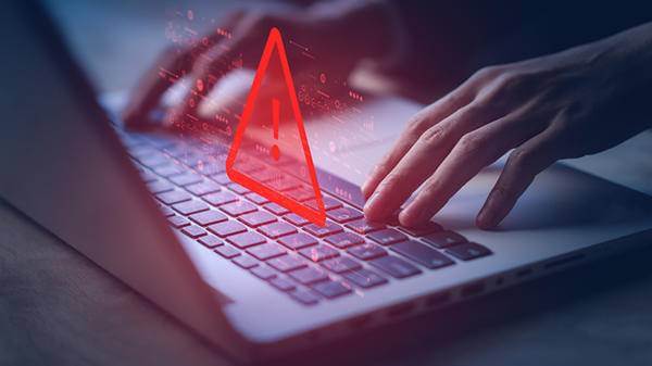 Fraudster using computer