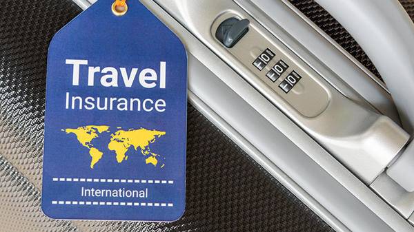 Insurance tag and suitcase