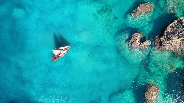 Boat in the blue sea 