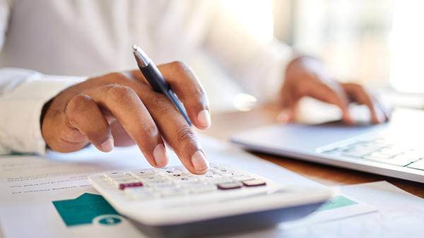 Person using calculator 