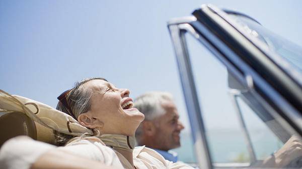 Mature woman travelling happy in car 