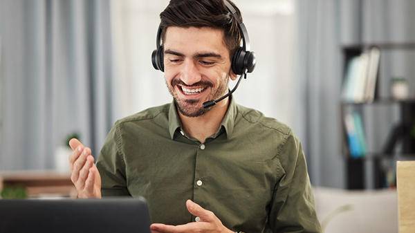 Man using headset talking computer
