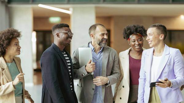 Image of employees smiling together