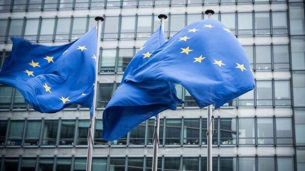 Image of European Union flags outside building
