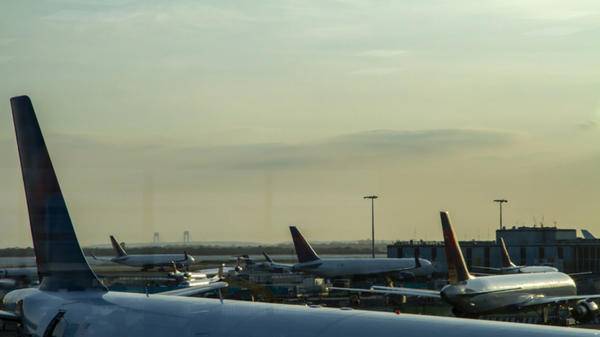 Image of multiple planes on the ground at an airport