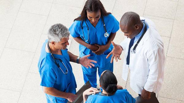 Doctors/nurses talking in the corridor hospital