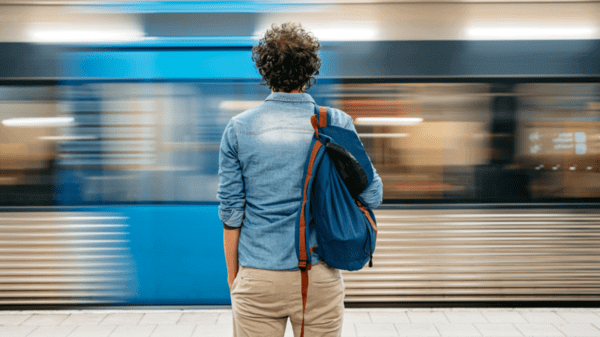 Person looking out at a underground train going past 