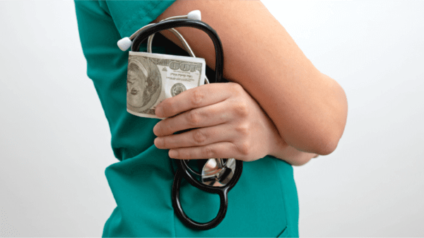 Doctor holding money