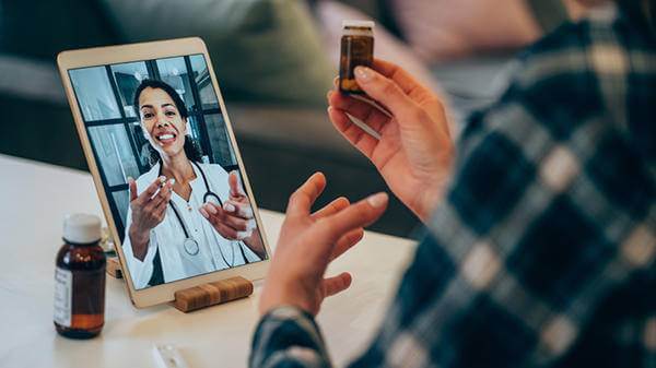 Doctor communicating to patient through an iPad