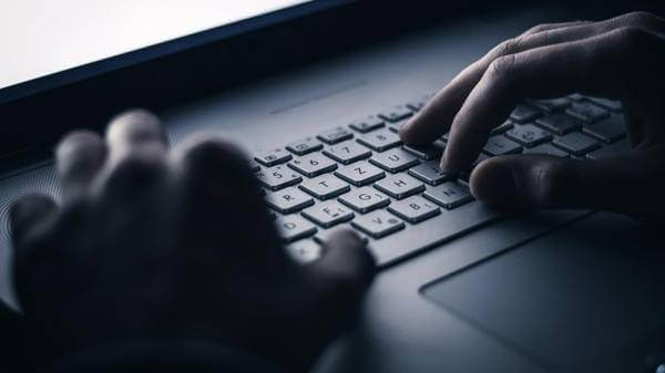 Image of person on laptop